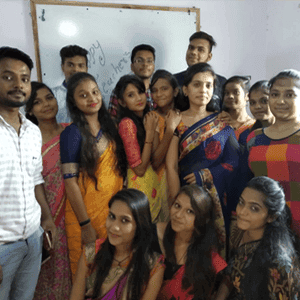 Global IT students receiving guidance from a mentor
